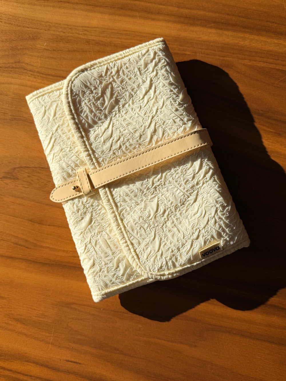 Cream Textured Cosmetic Roll with Beige Strap